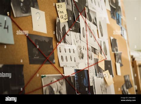 Detective board with crime scene photos, stickers, clues and red thread