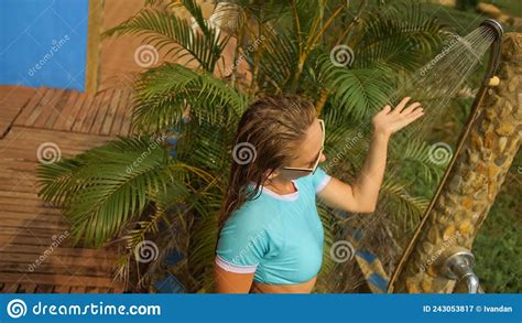 Woman Taking A Shower In Garden Near Hotel Girl In Blue Swimsui Stock Image Image Of