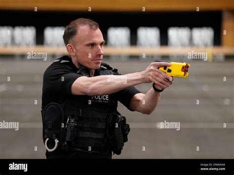 An Officer Holds The New Taser 7 During A Demonstration As Hampshire And Isle Of Wight