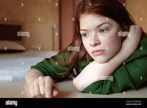 Vertical Portrait Of Pensive Redhead Teenage Girl Stock Photo Alamy