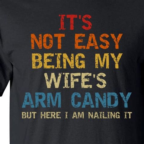 it s not easy being my wife s arm candy but here i am nailing it tall t shirt teeshirtpalace