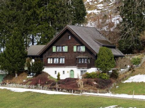 Traditional Swiss Architecture And Wooden Alpine Houses In An Early