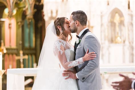 Bride And Groom Seal Their Marriage With A Kiss At The Alter
