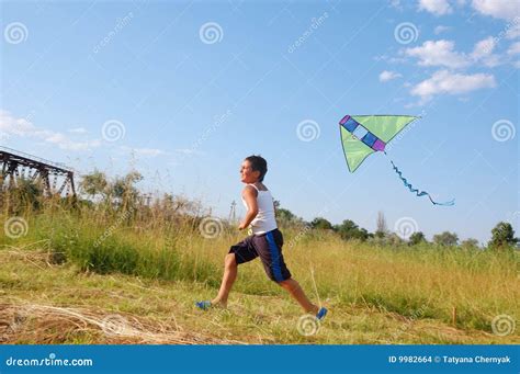 Boy Flying A Kite Stock Photo Image Of Clouds Hobby 9982664
