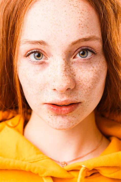 Portrait Of A Red Haired Girl With Freckles In A Black Hood Stock