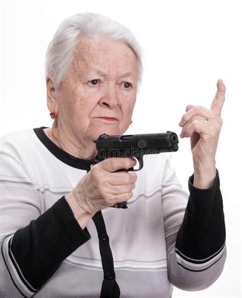 Old woman with pistol stock photo. Image of sadness, grandmother - 38854130