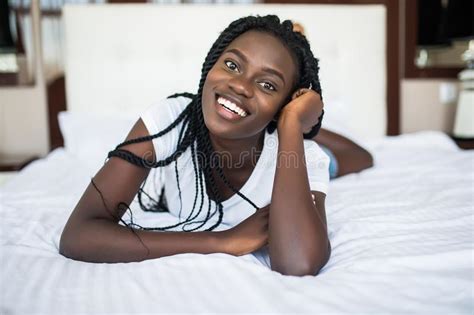 Young Beautiful African American Woman Lying Relaxed On Bed Stock Image Image Of Girl African