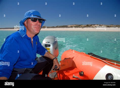 Marine Biologist Dr Alan Kendrick Drives Rubber Inflatable Boat Stock