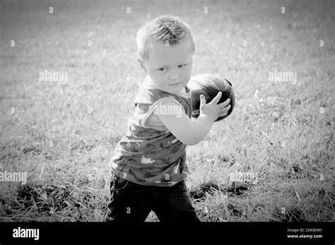 Boy Playing Football Stock Photo Alamy