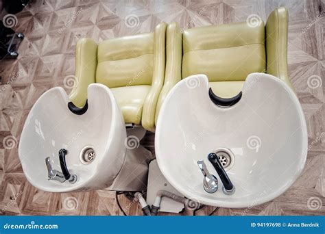 A Row Of Hair Washing Sinks White Washbasins For Hairdresser Stock