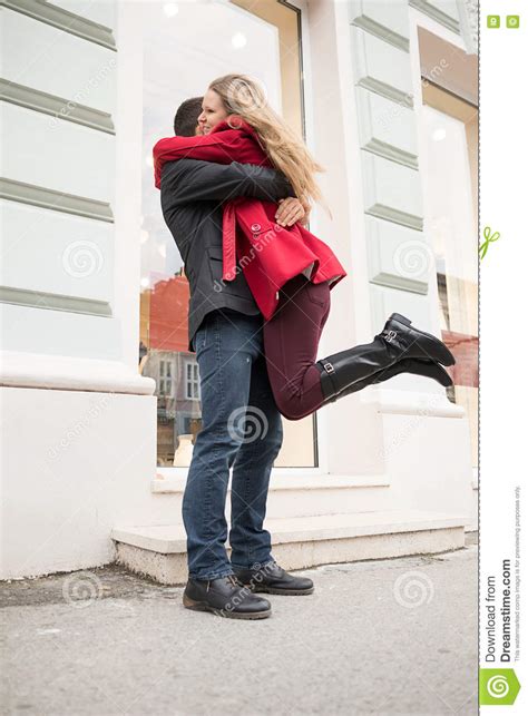 Euphoric Young Couple Meeting And Hugging On The Street Stock Image