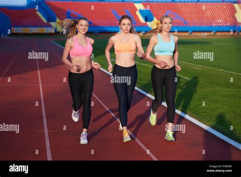 Athlete Woman Group Running On Athletics Race Track Stock Photo Alamy