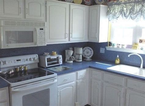 This is the process of redoing the finish on cabinetry along with upgrading the style. blue kitchens with white cabinets | Cabinet Refacing Photo ...