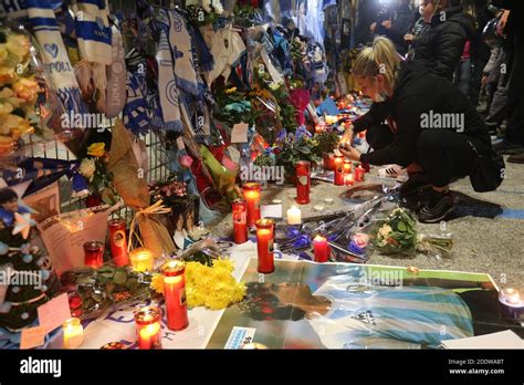 Naples, Italy. 26th Nov, 2020. A supporter pays tribute to the tributes