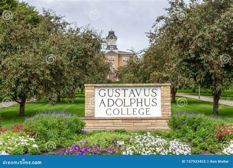 Entrance Sign And Old Main Clock At Gustavus Adolphus College Editorial