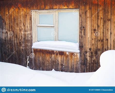 Frozen Hut Window In Winter Frost On Glass Snow And Snowdrifts