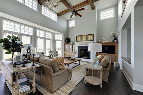 The great room showcases a gas fireplace and view to the rear yard. Stunning two story family room painted a crisp white with ...