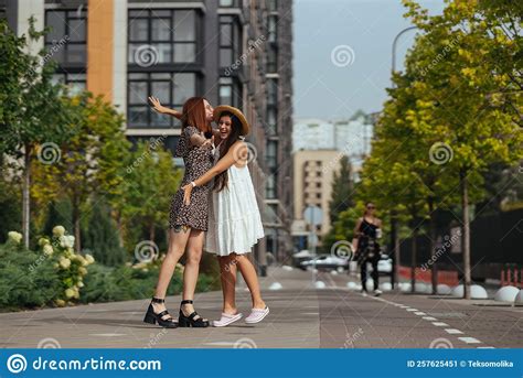 Happy Meeting Of Two Friends Hugging In The Street Stock Image Image