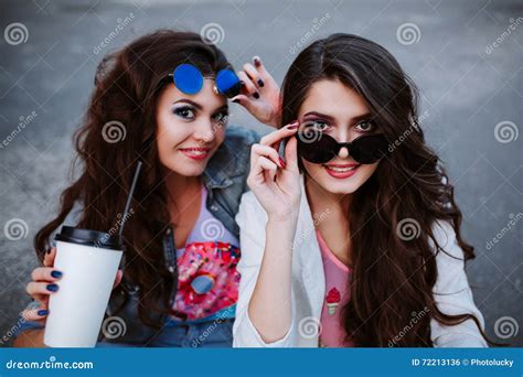 Outdoor Fashion Lifestyle Portrait Of Two Young Beautiful Women