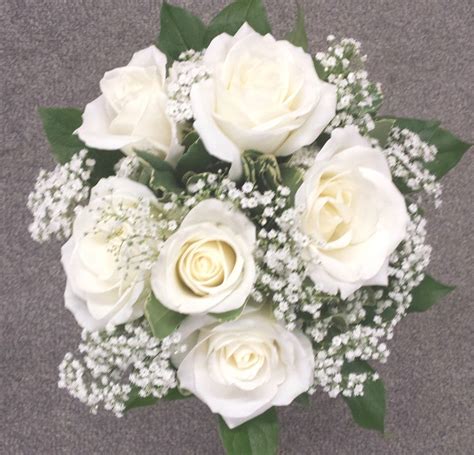 Hand tied bouquet - 6 white roses with babies breath | Hand tied bouquet, White roses, Babys breath
