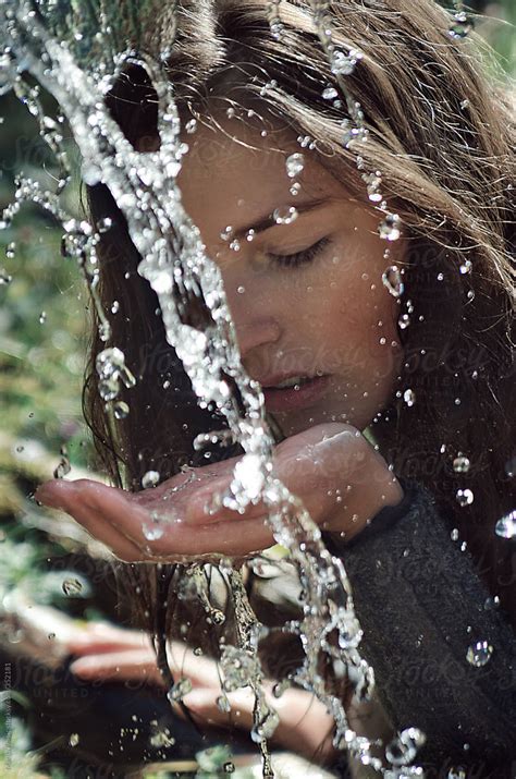 Portrait Of Beautiful Brunette Girl Drinking Spring Water By Marija Anicic