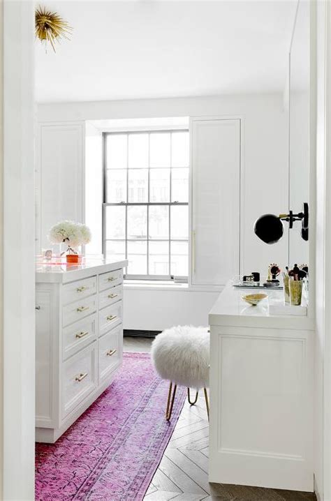 white walk  closet  pink overdyed rug contemporary