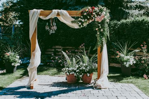 Officiant & romantic marriage ceremony including: DIY Wooden Wedding Arch With Flower Garland