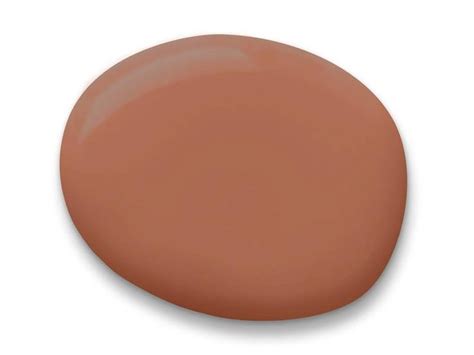 A Close Up View Of The Top Of A Round Light Brown Paint