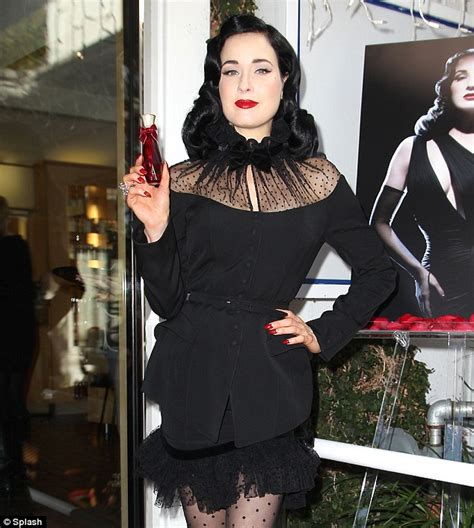 Dita Von Teese Arrives Late To Perfume Launch After Her Cat Naps On Her