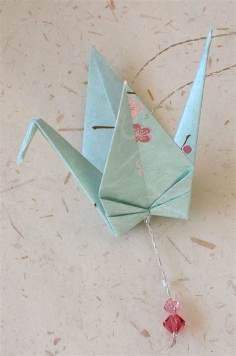 So if you want to have a paper fan that is 16 inches wide, for example, you should use paper squares that are 16 by 16 inches wide. Origami Crane Hanging Ornament pale teal Japanese paper | Etsy in 2020 | Hanging ornaments ...