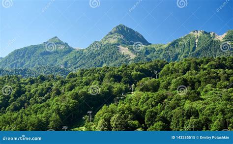High Green Mountains With Cable Lifts Blue Clear Sky Stock Image