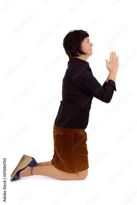 Woman Kneeling And Praying Stock Foto Adobe Stock