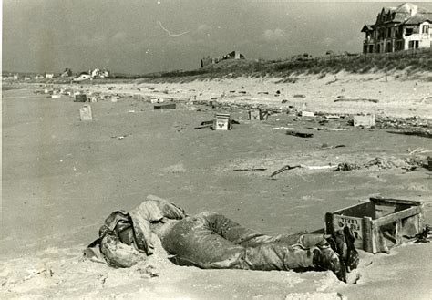 Dead British Soldier Washed Up On Littered Normandy Beach France 1944