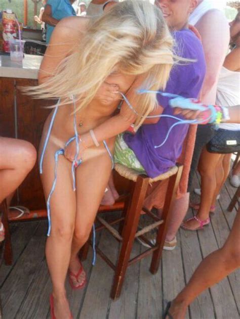 Covering Up Her Nearly Naked Body By The Beach Bar Porn Photo