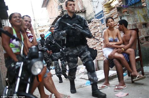 Armed Police And Helicopters In Rio Slum In Clean Up Ahead Of Brazil