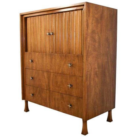 Goyard saint louis tote displayed on a tall white bamboo dresser in a bedroom with lovely natural light, white walls, and french doors with light blue curtains. John Widdicomb Tambour Door Tall Chest Dresser, Mid ...