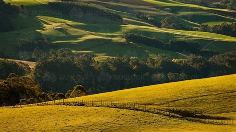 Image Of Late Afternoon Sunlight On Rolling Hills Of Farmland
