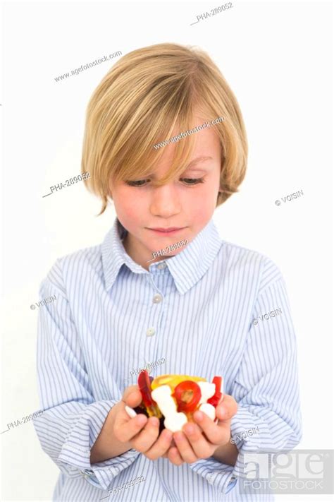 7 Year Old Boy Eating Sugary Sweets Stock Photo Picture And Rights