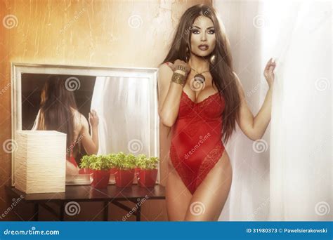 Brunette Woman Posing On Red Lingerie Looking At Camera Stock Image Image Of Fashion People