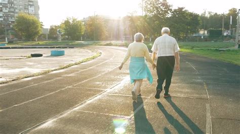 Senior Couple Walk On Track Stock Video Motion Array