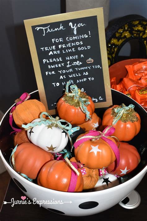 A Bowl Filled With Lots Of Fake Pumpkins Next To A Sign That Says Thank You