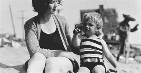 A Young Marilyn Monroe With Her Mother At The Beach