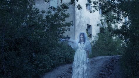 Download A mysterious figure shrouded in an ambient light | Wallpapers.com