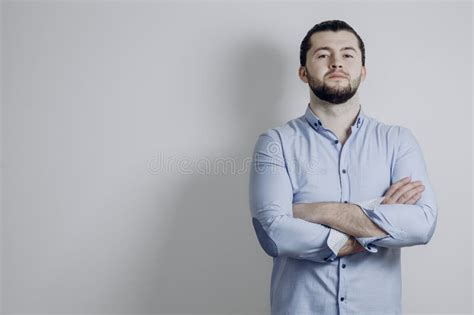 Portrait Of Successful Serious Guy With Arms Crossed And Smile Stock