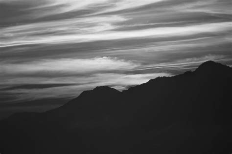Silhouette Of Mountain Under Cloudy Sky · Free Stock Photo