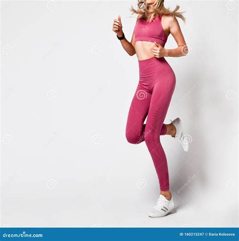 Blonde Woman With Perfect Athletic Slim Figure By Physical Education Or
