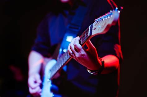 Premium Photo Man Playing Guitar On A Stage Musical Concert Closeup Viewguitarist Plays