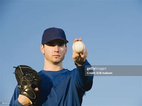 Baseball Player Holding Ball High Res Stock Photo Getty Images