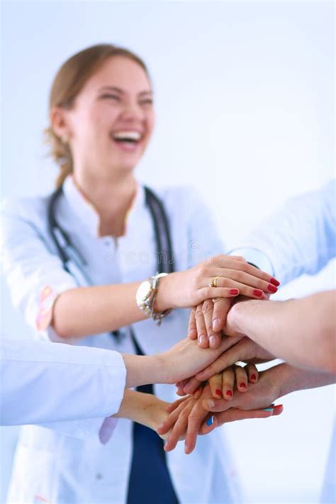 Doctors And Nurses In A Medical Team Stacking Stock Photo Image Of