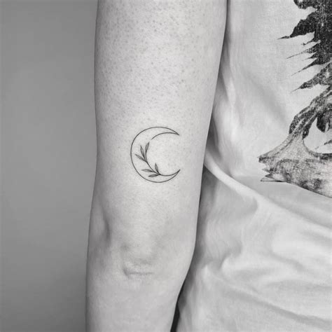 Fine Line Flower Moon Tattoo On The Tricep
